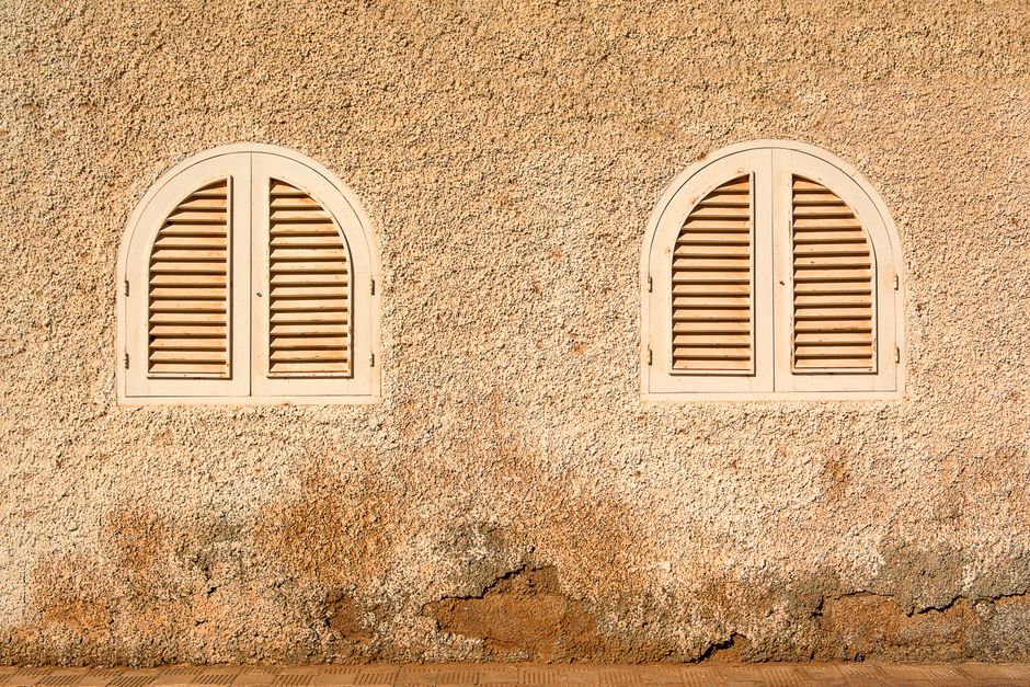 High-quality wooden plantation shutters in a sunlit room