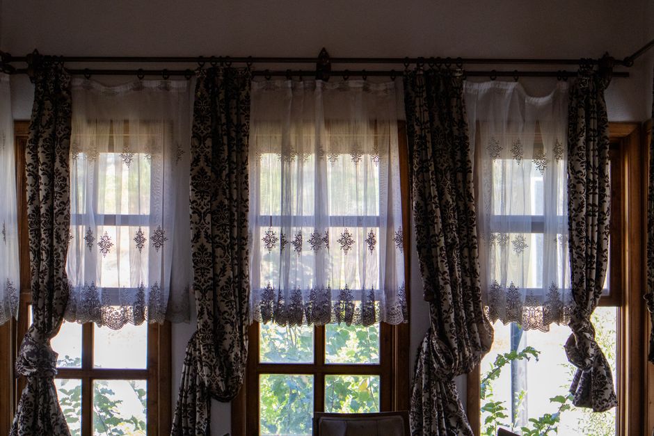 Luxurious custom drapes framing a large window