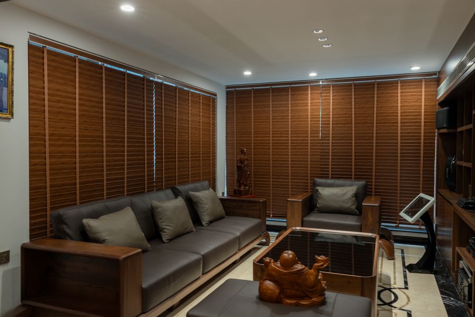 Modern living room featuring elegant custom window treatments